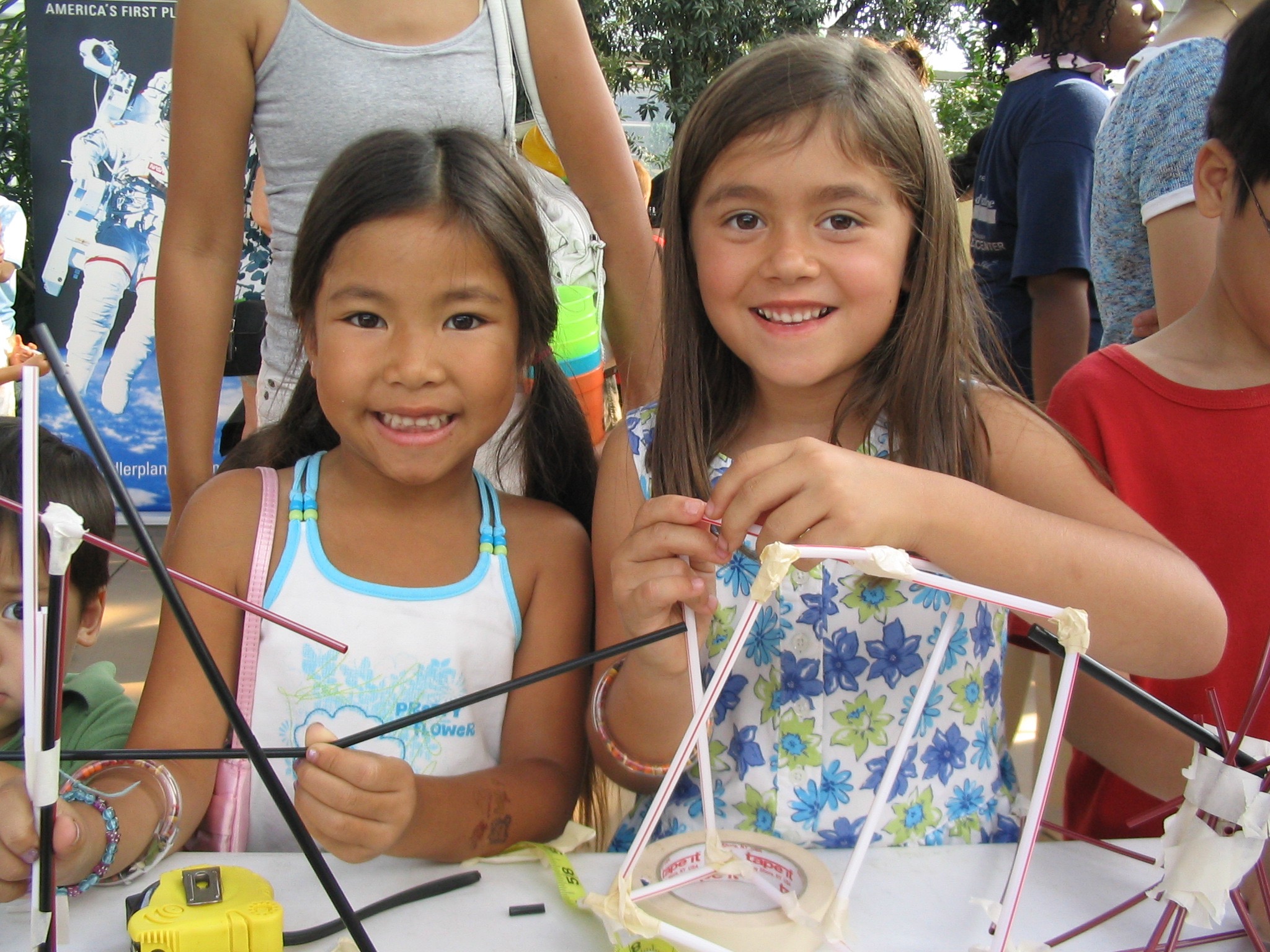 The Science Olympiad Straw Towers activity engaged students and families during a neighborhood Science in the City event, where they were challenged to build the tallest structure capable of holding a tennis ball for three seconds.  More than 5,000 people and all 604 Chicago Public Schools participated in the Straw Tower Challenge in 2007.