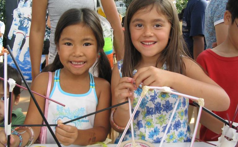 The Science Olympiad Straw Towers activity engaged students and families during a neighborhood Science in the City event, where they were challenged to build the tallest structure capable of holding a tennis ball for three seconds.  More than 5,000 people and all 604 Chicago Public Schools participated in the Straw Tower Challenge in 2007.
